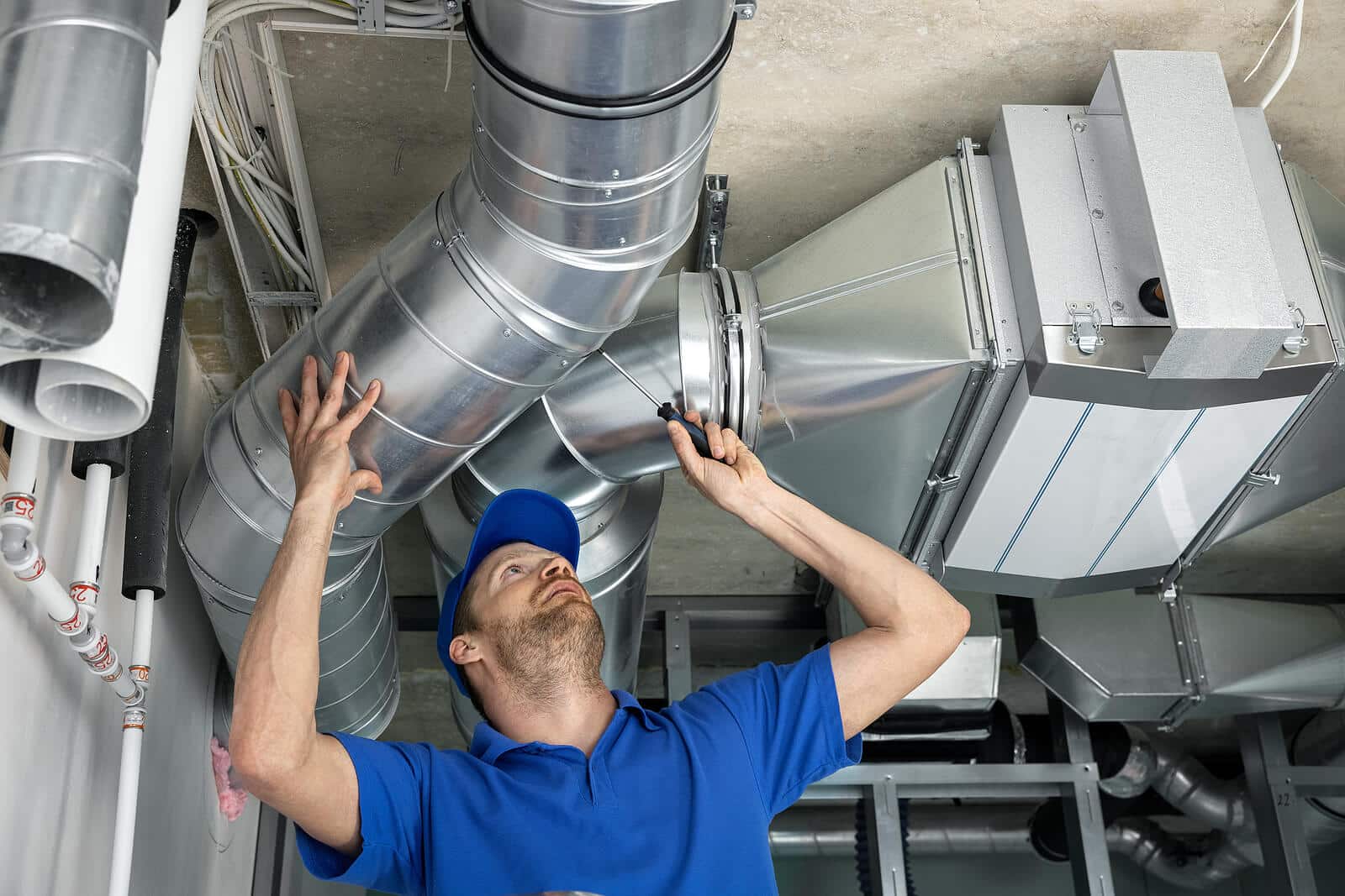 HVAC technician inspecting and repairing air ducts in Alhambra